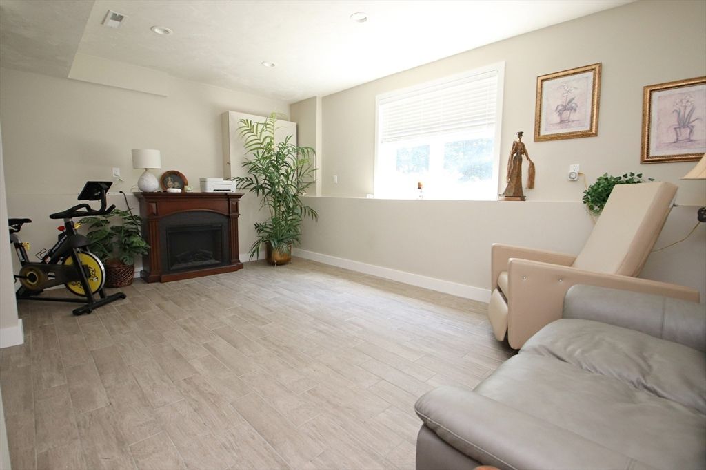 Fireplace, Fitness Equipment, Interior, Recessed Lighting, Wood Texture Flooring