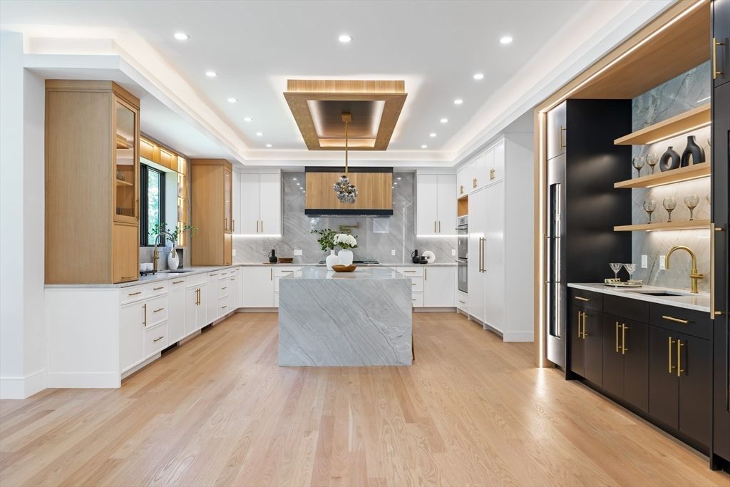 Interior, Kitchen, Marble Walls, Recessed Lighting, Stainless Steel Appliances, Wood Texture Flooring