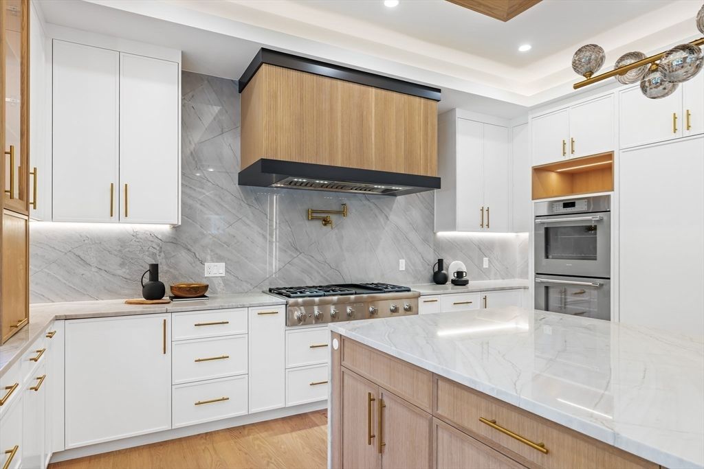 Interior, Kitchen, Marble Walls, Recessed Lighting, Stainless Steel Appliances, Wood Texture Flooring