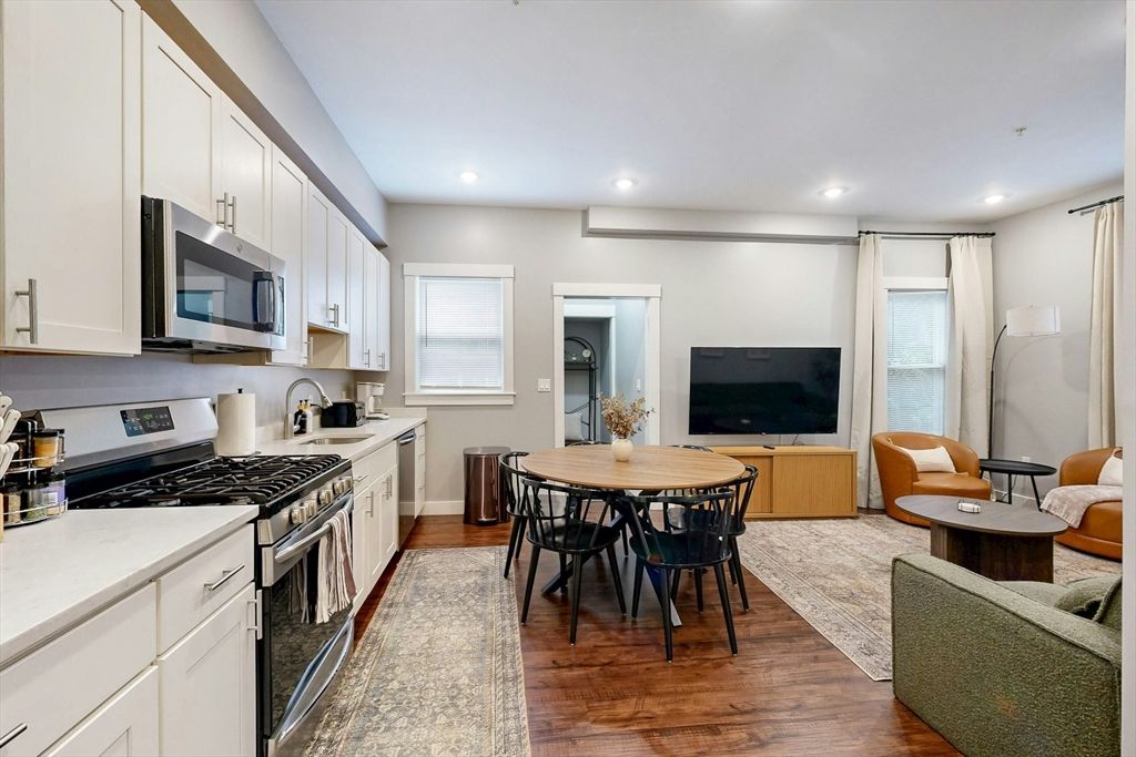 Dining room, Interior, Kitchen, Living room, Recessed Lighting, Stainless Steel Appliances, Wood Texture Flooring