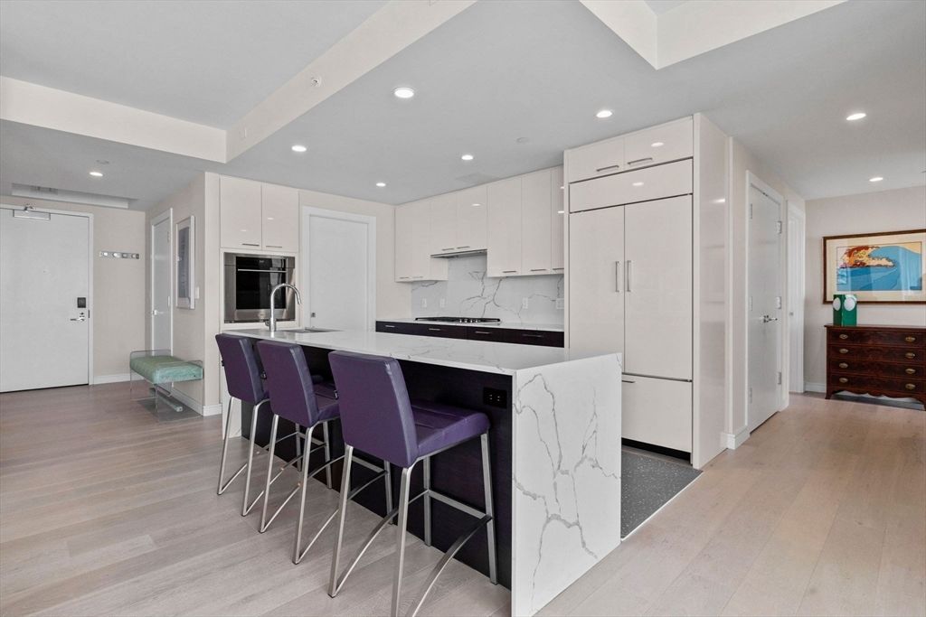 Interior, Kitchen, Marble Walls, Recessed Lighting, Stainless Steel Appliances, Wood Texture Flooring