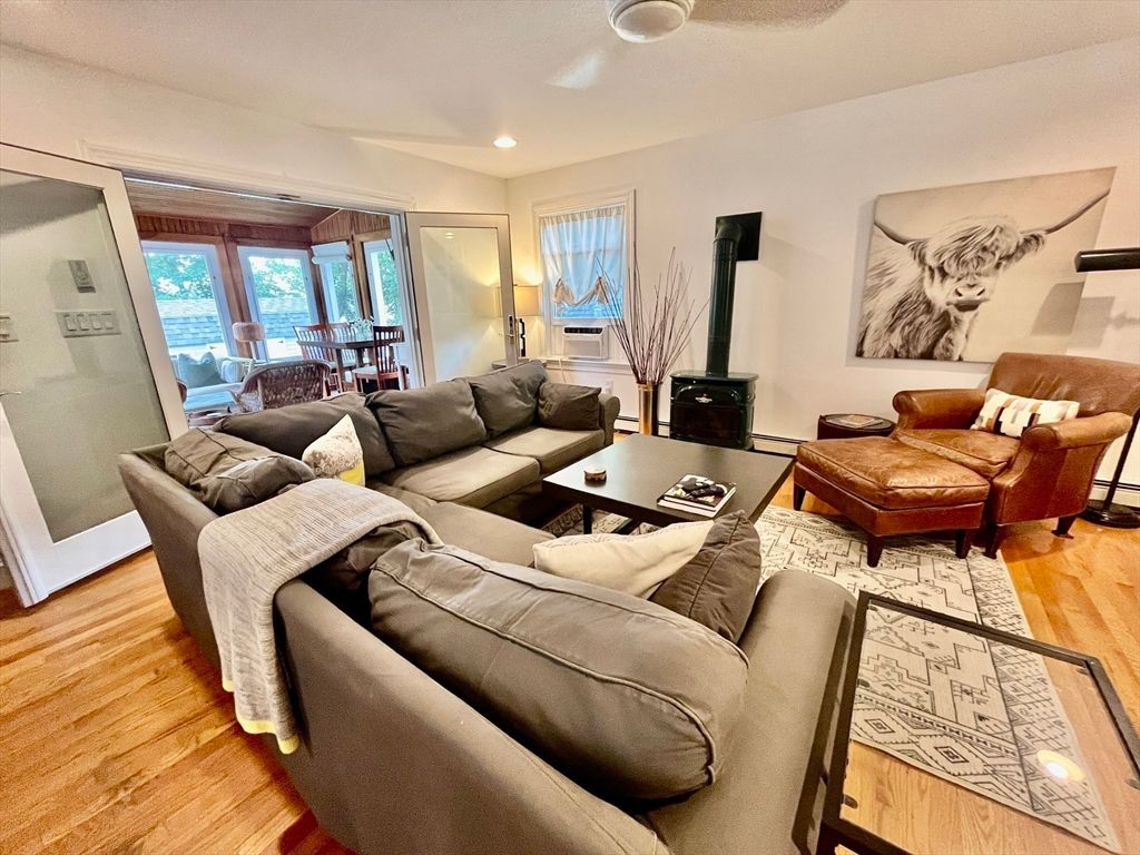 Dining room, Fireplace, Interior, Living room, Recessed Lighting, Wood Texture Flooring