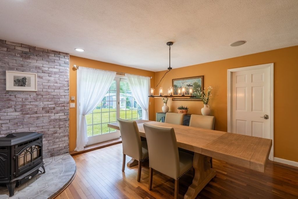 Dining room, Fireplace, Interior, Pendant Lights, Recessed Lighting, Stone Walls, Wood Texture Flooring
