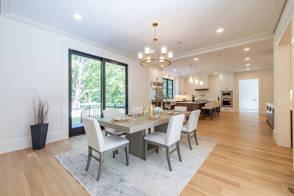 Chandelier, Dining room, Interior, Kitchen, Pendant Lights, Recessed Lighting, Stainless Steel Appliances, Wood Texture Flooring