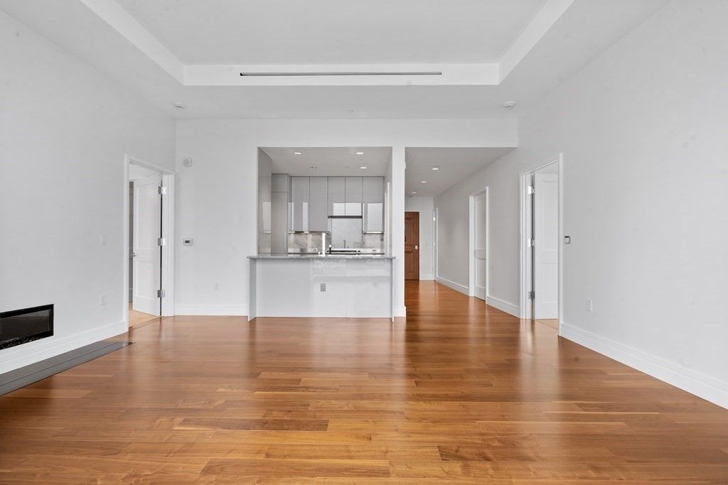Empty room, Fireplace, Interior, Kitchen, Recessed Lighting, Wood Texture Flooring
