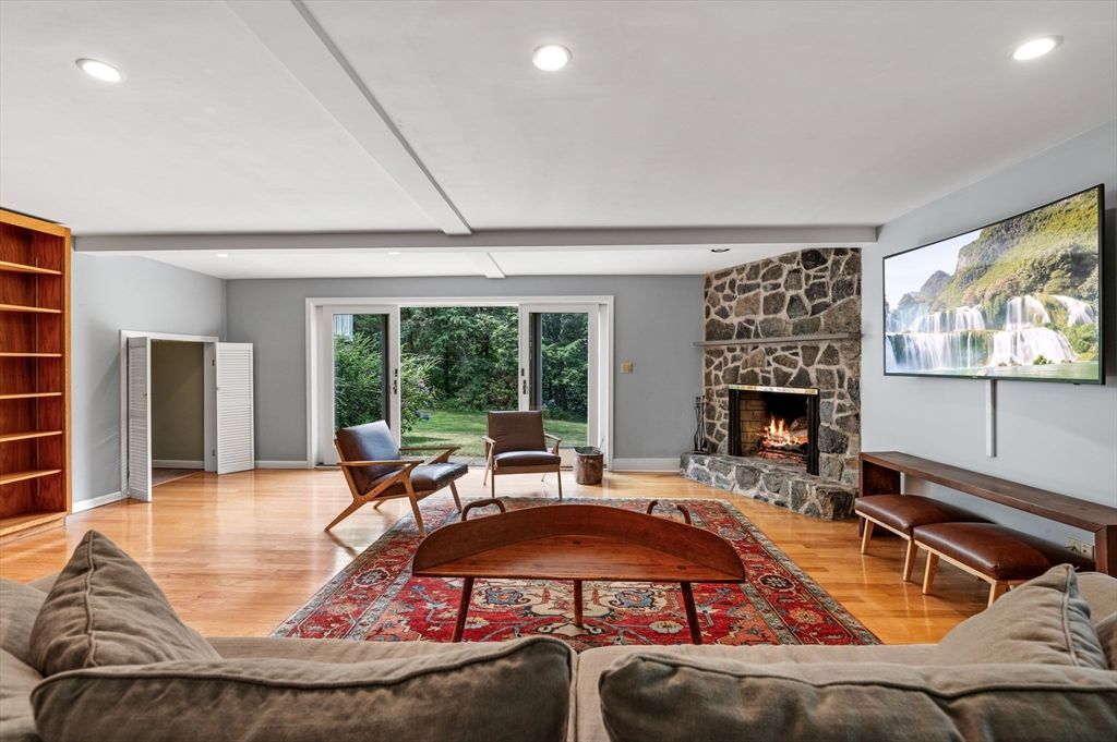Fireplace, Interior, Living room, Recessed Lighting, Stone Walls, Wood Texture Flooring