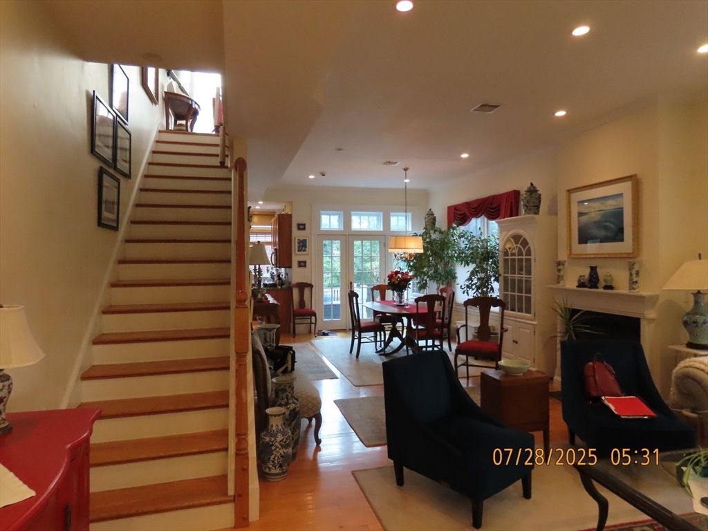 Dining room, Fireplace, Interior, Living room, Pendant Lights, Recessed Lighting, Wood Texture Flooring