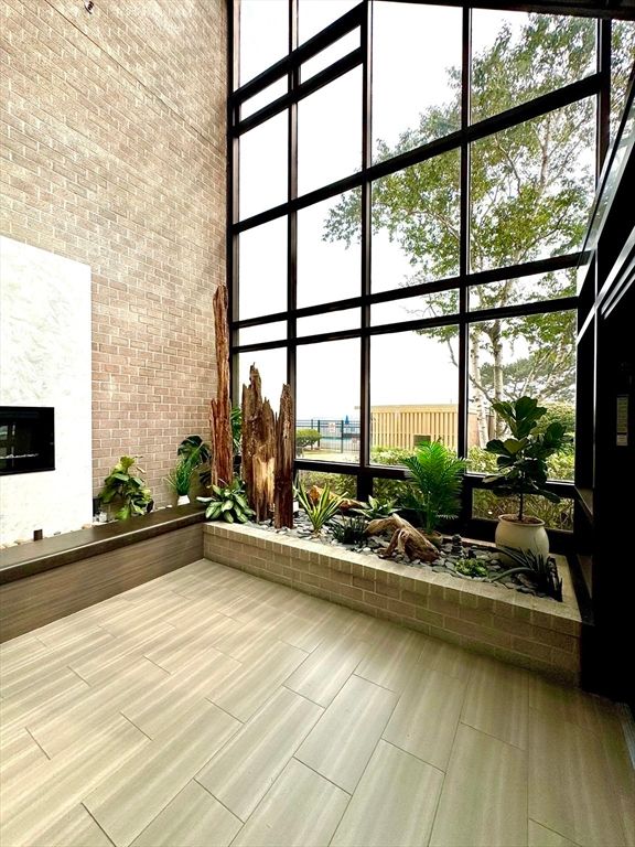 Fireplace, Interior, Sun Room, Wood Texture Flooring