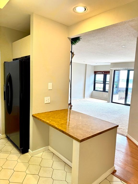 Interior, Kitchen, Recessed Lighting, Washer, Wood Texture Flooring
