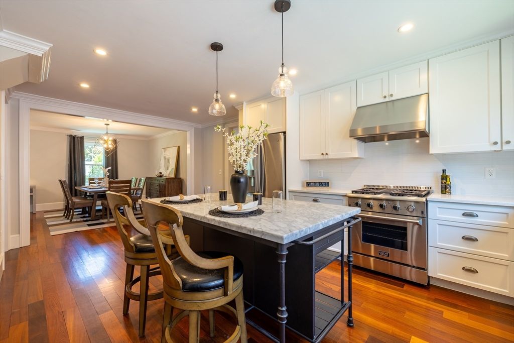 Dining room, Interior, Kitchen, Pendant Lights, Recessed Lighting, Stainless Steel Appliances, Wood Texture Flooring