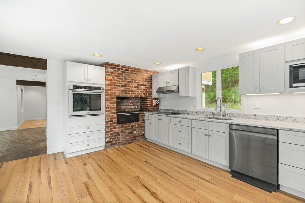 Interior, Kitchen, Recessed Lighting, Stainless Steel Appliances, Stone Walls, Wood Texture Flooring