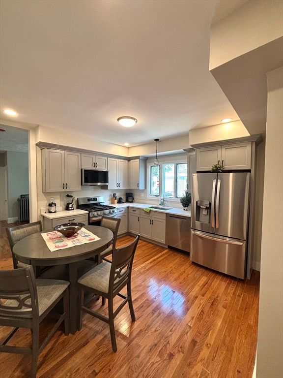 Dining room, Interior, Kitchen, Pendant Lights, Recessed Lighting, Stainless Steel Appliances, Wood Texture Flooring