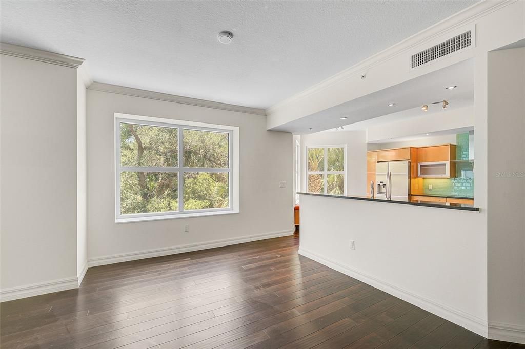 Empty room, Interior, Kitchen, Recessed Lighting, Stainless Steel Appliances, Wood Texture Flooring