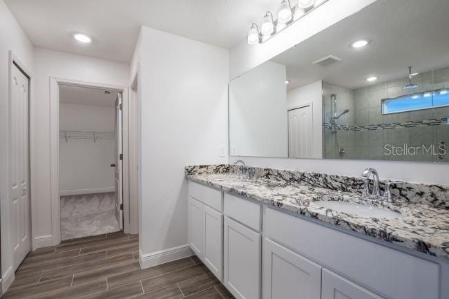 Bathroom, Dual Sink Vanities, Interior, Recessed Lighting, Wood Texture Flooring