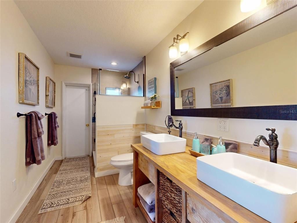 Bathroom, Dual Sink Vanities, Interior, Recessed Lighting, Wood Texture Flooring