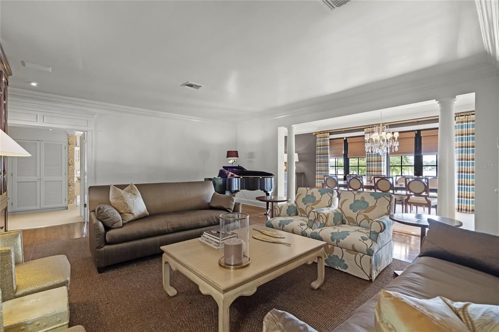 Chandelier, Dining room, Interior, Living room, Piano, Recessed Lighting, Wood Texture Flooring