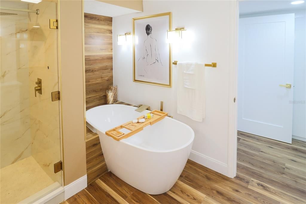 Bathroom, Free Standing Baths, Glass Shower, Interior, Marble Walls, Recessed Lighting, Wood Texture Flooring