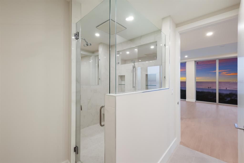 Bathroom, Glass Shower, Interior, Marble Walls, Recessed Lighting, Wood Texture Flooring