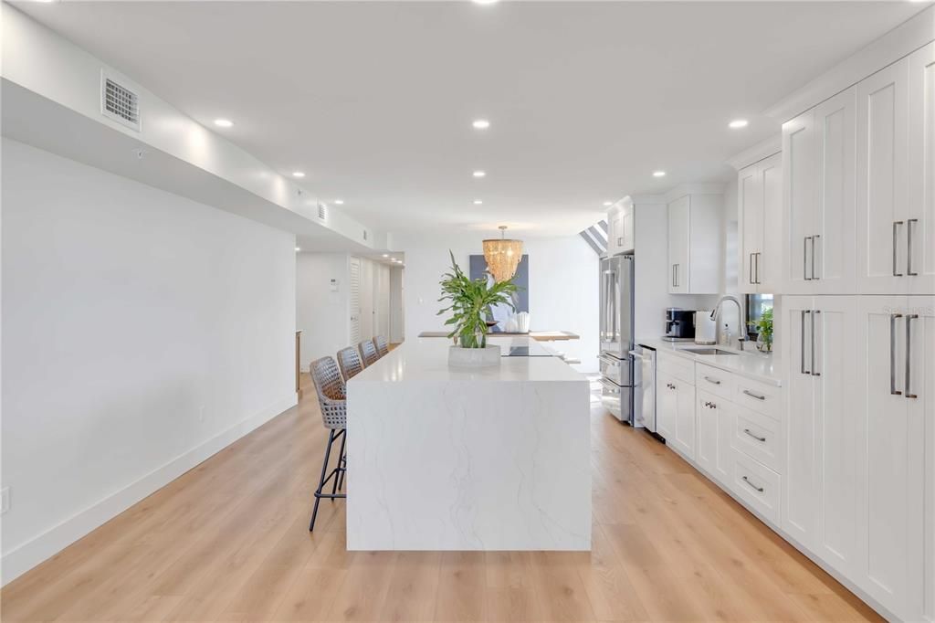 Chandelier, Dining room, Interior, Kitchen, Recessed Lighting, Stainless Steel Appliances, Wood Texture Flooring