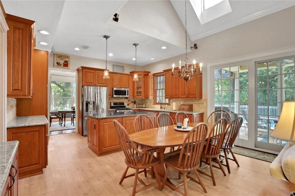 Chandelier, Dining room, Interior, Kitchen, Pendant Lights, Recessed Lighting, Stainless Steel Appliances, Wood Texture Flooring