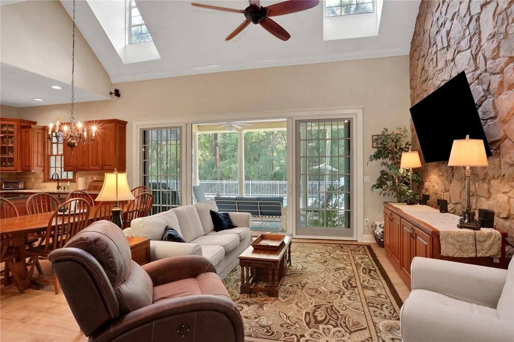 Chandelier, Dining room, Fireplace, Interior, Kitchen, Living room, Recessed Lighting, Stone Walls