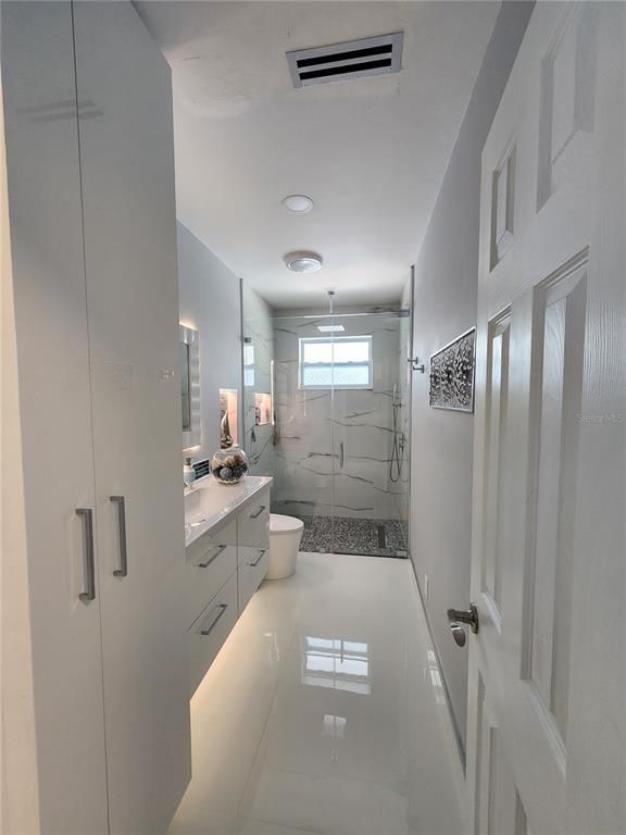 Bathroom, Dual Sink Vanities, Glass Shower, Interior, Marble Walls