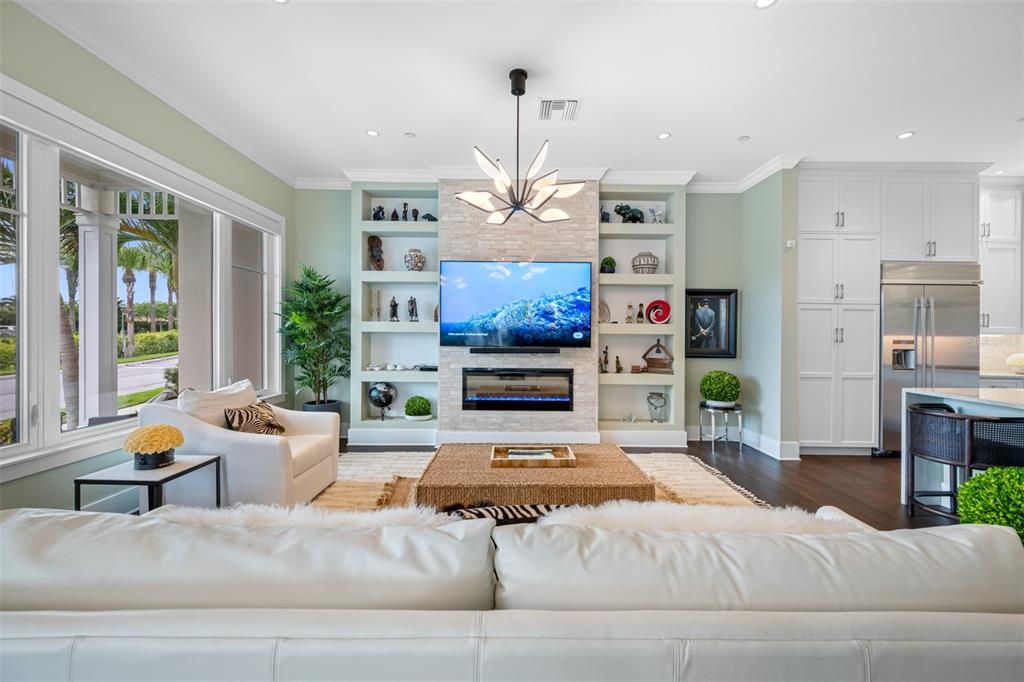 Fireplace, Interior, Kitchen, Living room, Pendant Lights, Recessed Lighting, Stainless Steel Appliances, Wood Texture Flooring