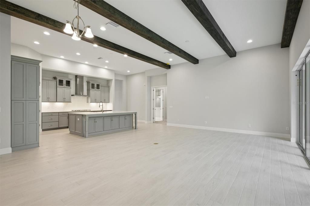 Chandelier, Empty room, Interior, Kitchen, Recessed Lighting, Wooden Beams, Wood Texture Flooring