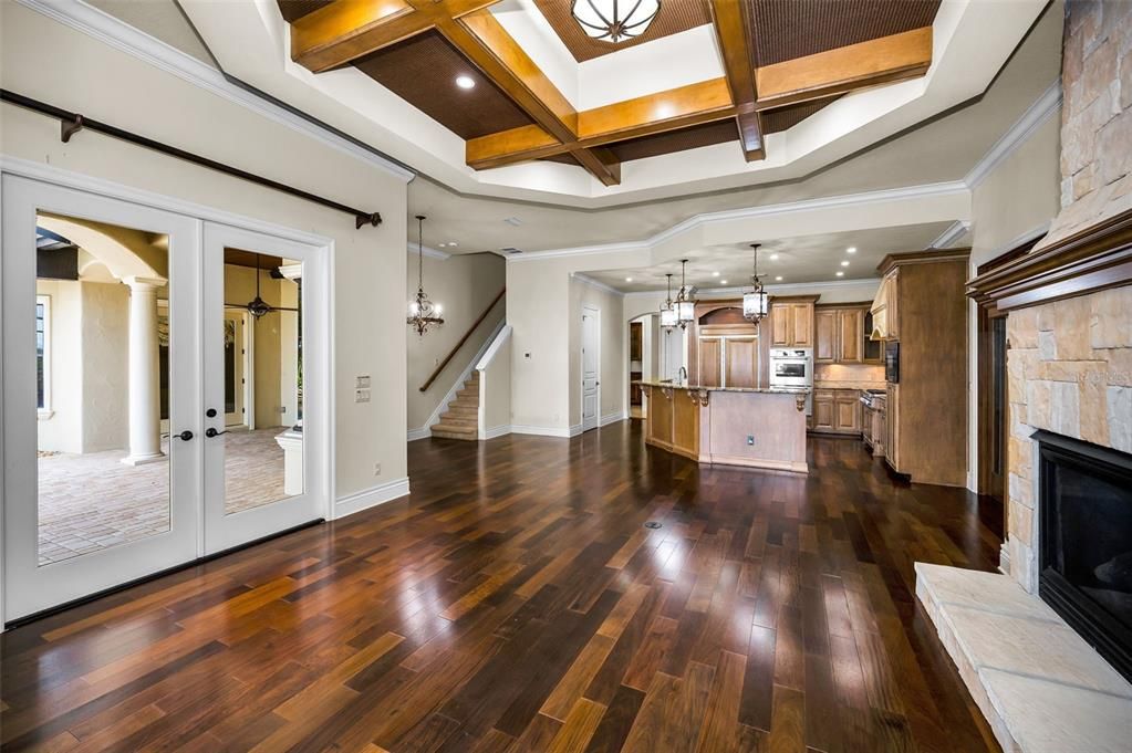 Fireplace, Interior, Kitchen, Pendant Lights, Recessed Lighting, Stainless Steel Appliances, Stone Walls, Wooden Beams, Wood Texture Flooring