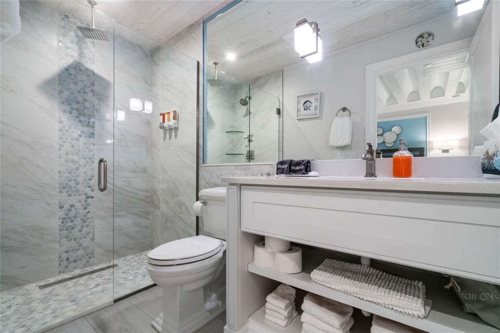 Bathroom, Glass Shower, Interior, Marble Walls, Recessed Lighting, Wood Texture Flooring