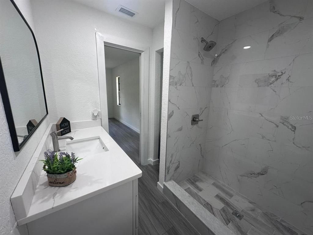 Bathroom, Interior, Marble Walls, Recessed Lighting, Wood Texture Flooring