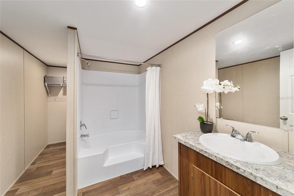 Bathroom, Dual Sink Vanities, Interior, Recessed Lighting, Walk-in Closets, Wood Texture Flooring