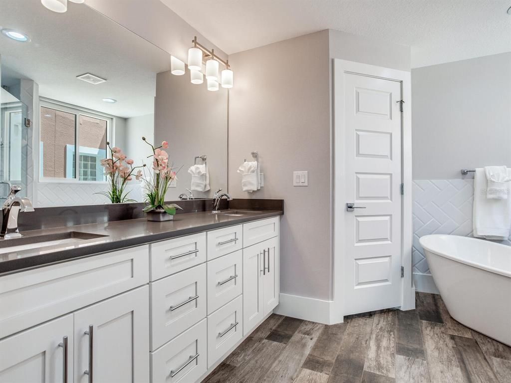 Bathroom, Dual Sink Vanities, Free Standing Baths, Interior, Recessed Lighting, Wood Texture Flooring
