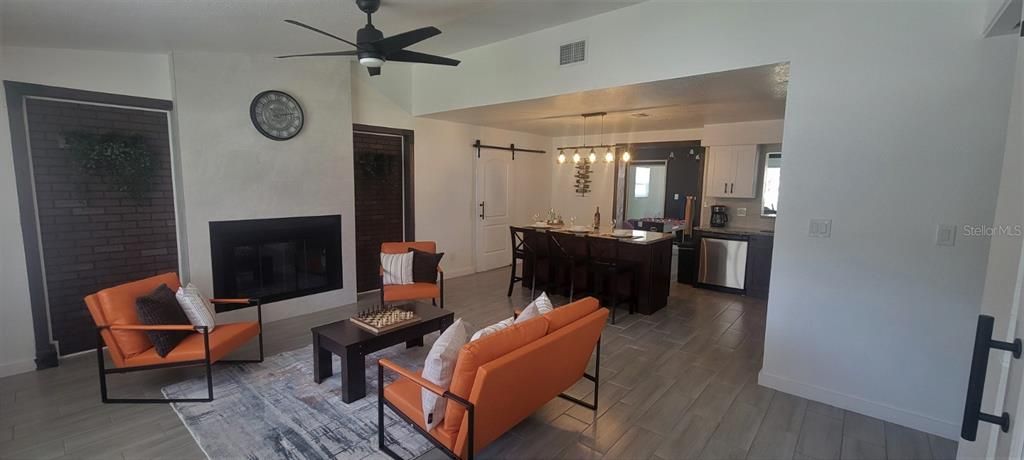 Dining room, Fireplace, Interior, Kitchen, Living room, Pendant Lights, Stone Walls, Wood Texture Flooring