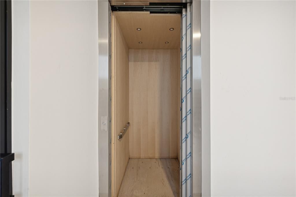 Elevator, Interior, Recessed Lighting, Wooden Ceilings, Wood Texture Flooring, Wooden Walls