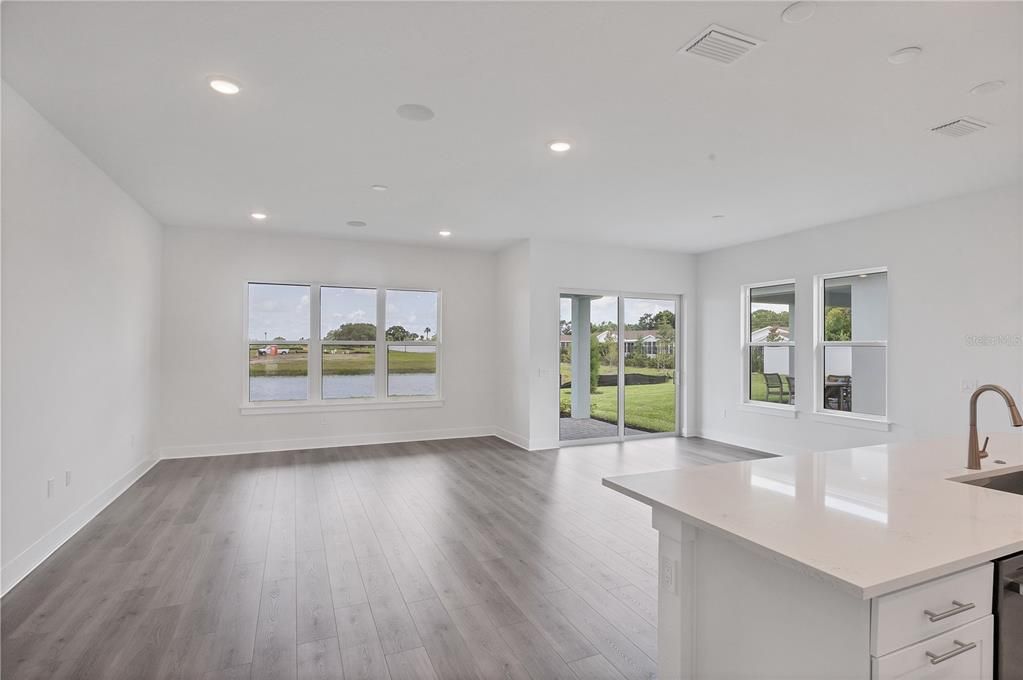 Empty room, Interior, Kitchen, Recessed Lighting, Water, Wood Texture Flooring