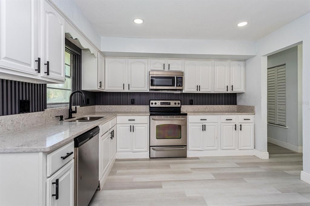 Interior, Kitchen, Recessed Lighting, Stainless Steel Appliances, Wood Texture Flooring