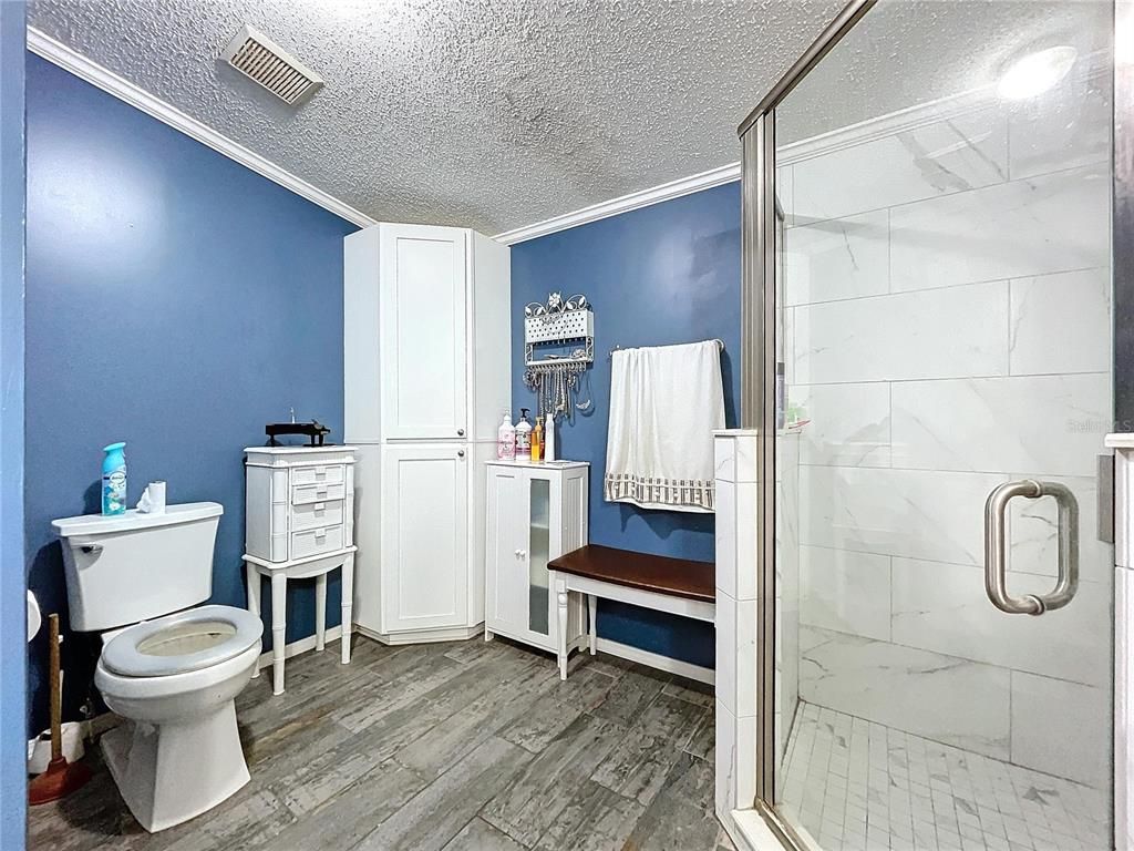 Bathroom, Glass Shower, Interior, Marble Walls, Wood Texture Flooring