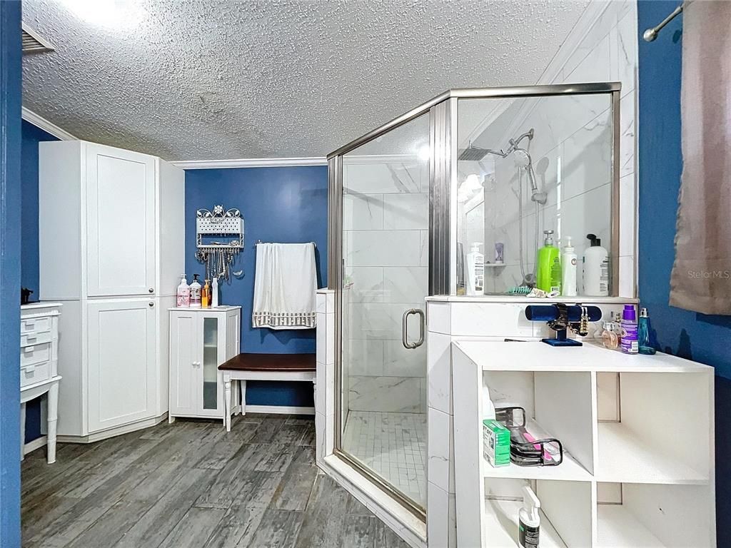 Bathroom, Glass Shower, Interior, Marble Walls, Wood Texture Flooring