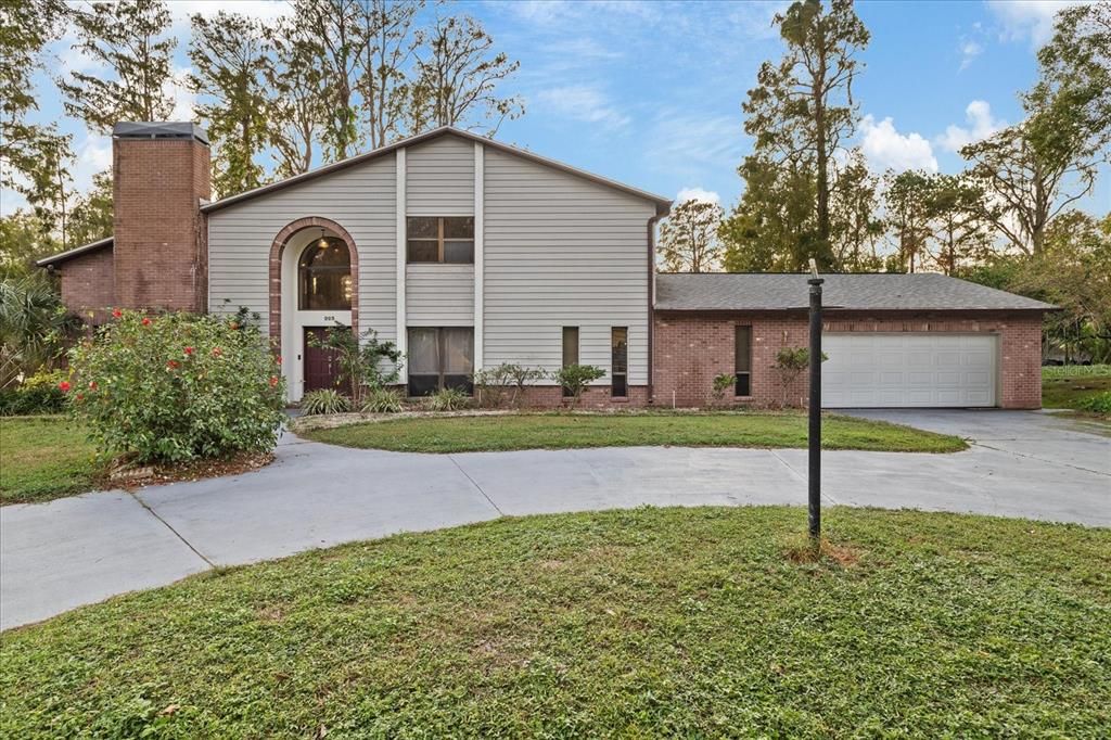 Attached, Backyard, Exterior, Facade, Brick Facade, Raised Ranch