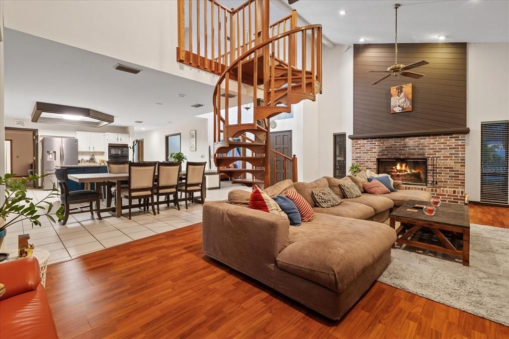 Dining room, Fireplace, Interior, Kitchen, Living room, Recessed Lighting, Wood Texture Flooring