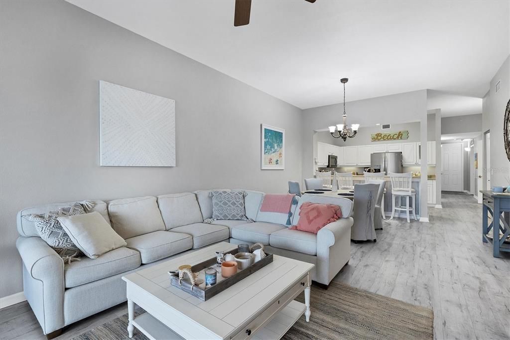 Chandelier, Dining room, Interior, Kitchen, Living room, Stainless Steel Appliances, Wood Texture Flooring