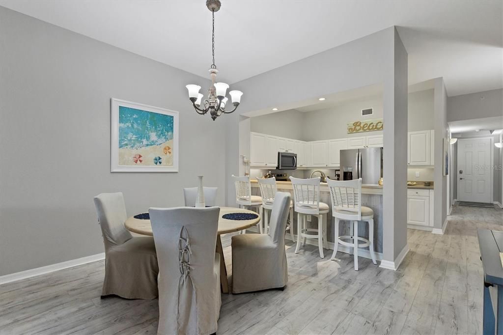 Chandelier, Dining room, Interior, Kitchen, Recessed Lighting, Stainless Steel Appliances, Wood Texture Flooring