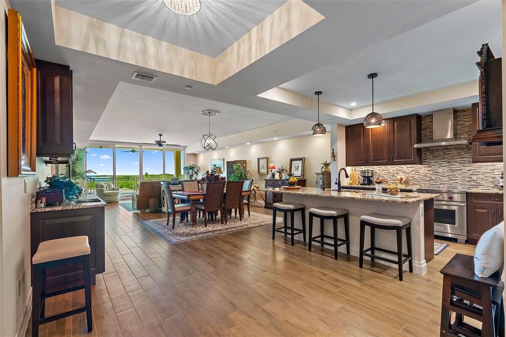 Dining room, Interior, Kitchen, Pendant Lights, Recessed Lighting, Stainless Steel Appliances, Wood Texture Flooring