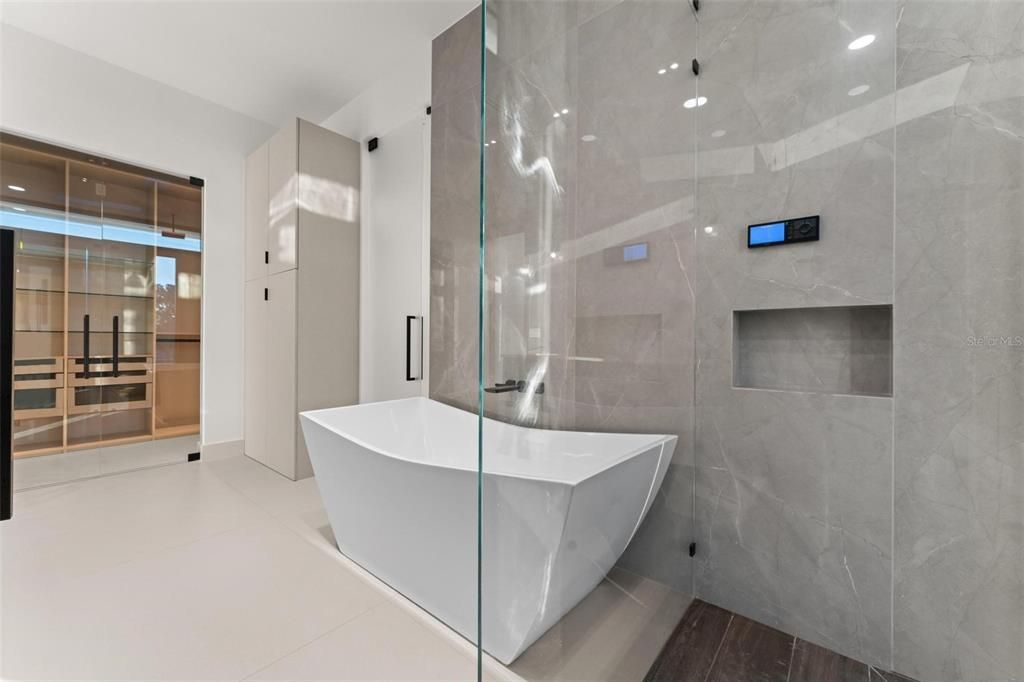 Bathroom, Free Standing Baths, Glass Shower, Interior, Marble Walls, Recessed Lighting