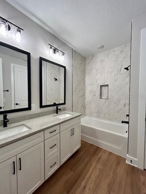 Bathroom, Dual Sink Vanities, Interior, Marble Walls, Wood Texture Flooring