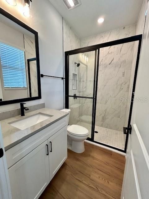 Bathroom, Glass Shower, Interior, Marble Walls, Recessed Lighting, Wood Texture Flooring