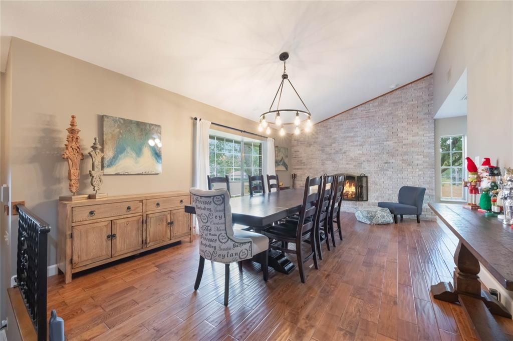 Chandelier, Dining room, Fireplace, Interior, Pendant Lights, Stone Walls, Wood Texture Flooring