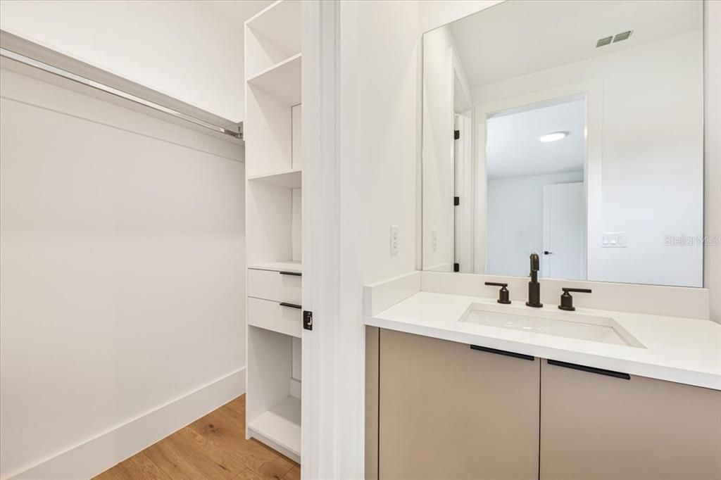 Bathroom, Dual Sink Vanities, Interior, Recessed Lighting, Walk-in Closets, Wood Texture Flooring