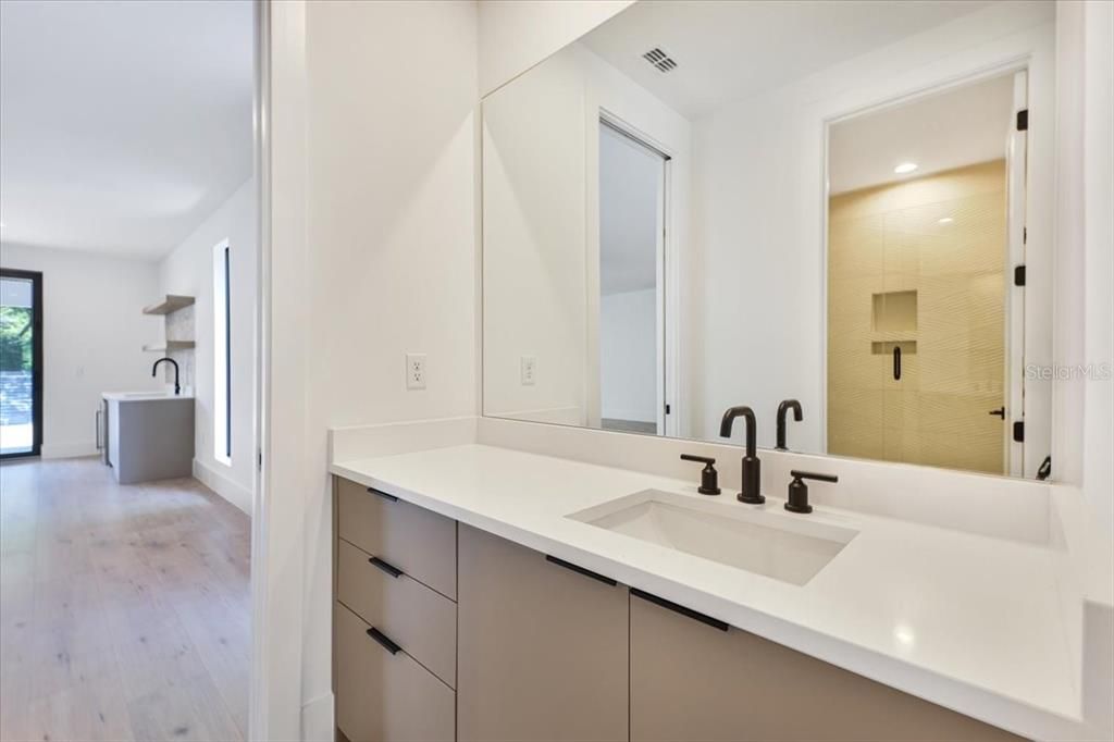 Bathroom, Dual Sink Vanities, Glass Shower, Interior, Recessed Lighting, Wood Texture Flooring